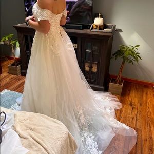 A line off the shoulder wedding gown